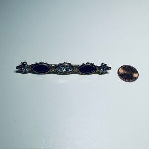 Elegant Black and Gold Brooch